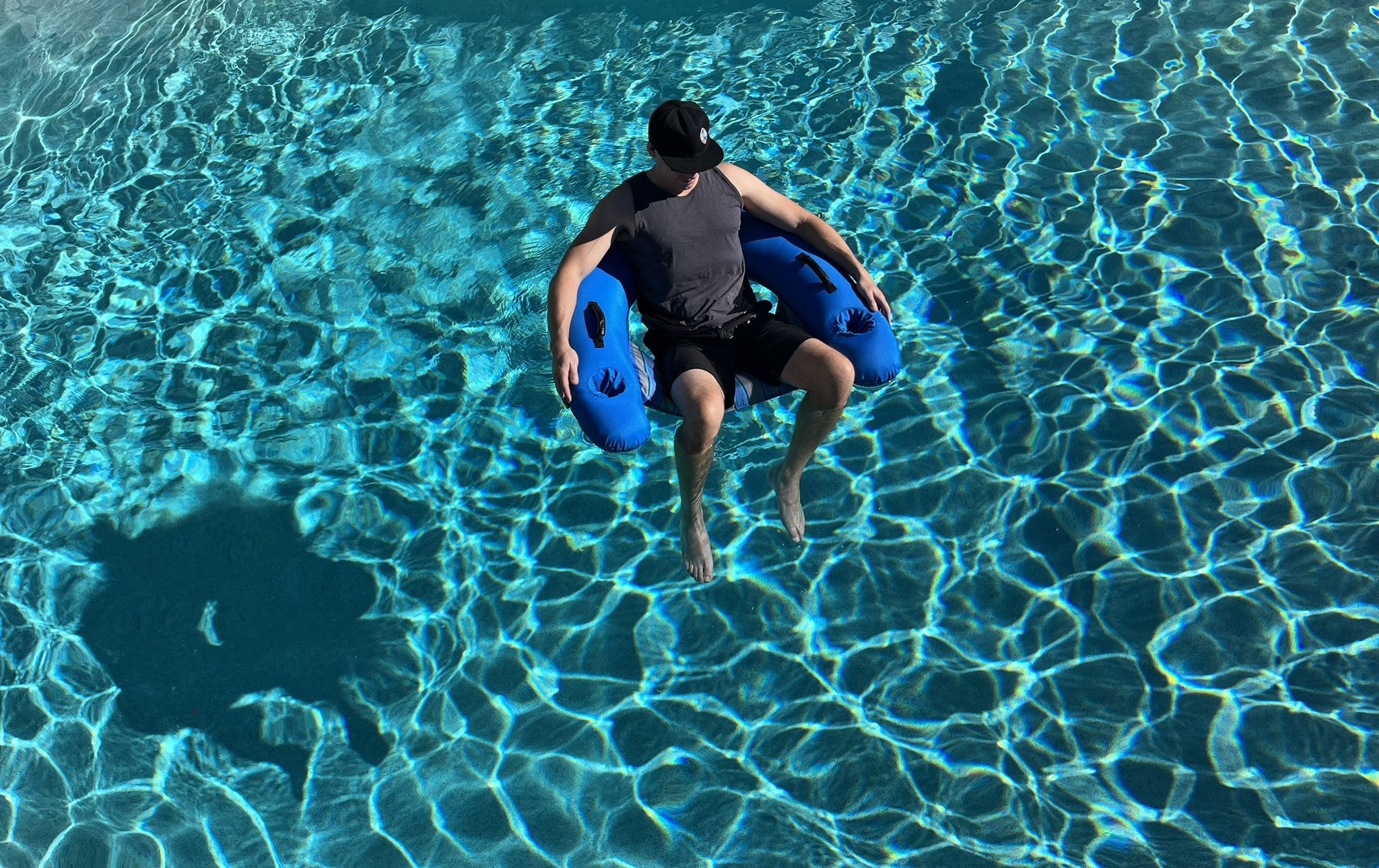 Man in AquaBoy Pool Chair from above angle.